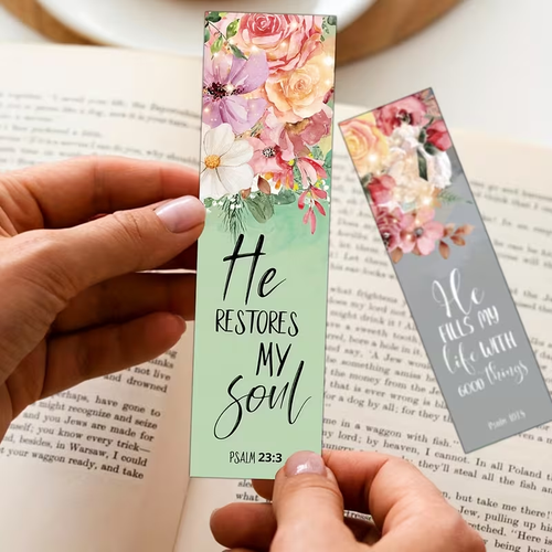 Christelijke boekenleggers met bloemen en bijbeltekst in de hand